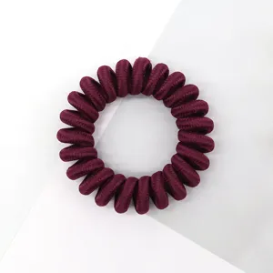 Matte burgundy telephone cord hair tie, elastic spiral hair coil, simple daily hair accessory.