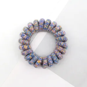 Detailed close-up of a colorful retro woven telephone wire hair tie elastic band.