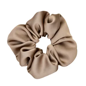 Brown satin hair scrunchie for women, elegant ponytail holder and stylish hair accessory.