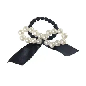 Elegant black bow pearl hair scrunchie korean style fashion ponytail holder accessory.
