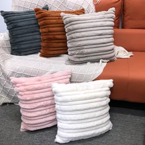 Detailed view of soft striped faux rabbit fur throw pillow covers for sofa and bedroom decor.