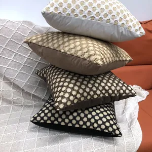 Detailed close-up showing the textured knit grid pattern and stacked design of the throw pillows.