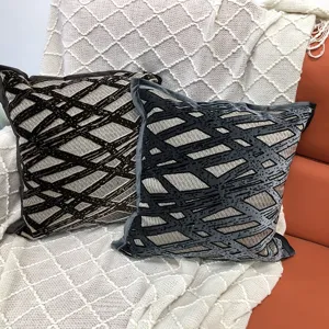 Close-up detail of luxurious cut velvet throw pillow with unique striped pattern texture.