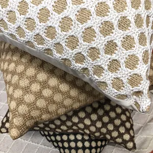 Woven PP grass cushion detail, geometric grid design for sofa and living room decor.