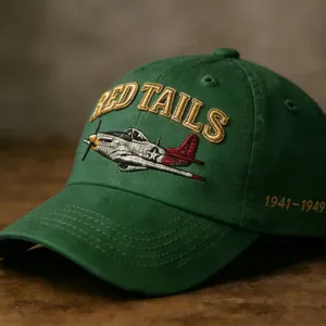 Vintage green cotton baseball cap with embroidered Red Tails fighter plane design.