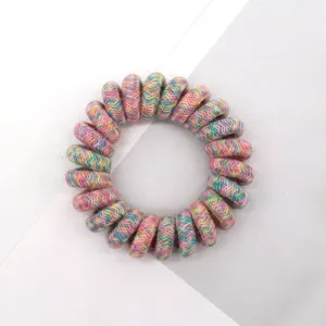 Colorful woven telephone wire hair tie detail, showing the textured fabric wrap and high elasticity.