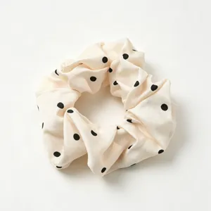 Chic beige polka dot fabric hair scrunchie, stylish French vintage hair accessory for women.