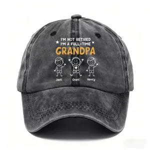 Detail view of washed grey baseball cap with custom grandpa quote and cute stick figure print design.