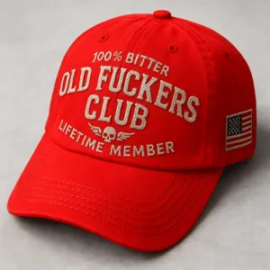 Red embroidered baseball cap with novelty slogan text and side flag patch for casual wear.
