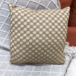 Knitted grid decorative throw pillow, cozy square cushion for sofa, home and office decor.