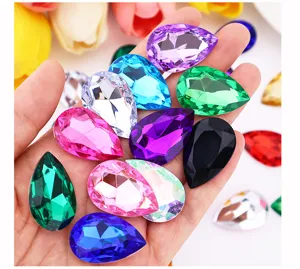 Close-up of colorful teardrop acrylic rhinestones multi-faceted DIY craft accessories.