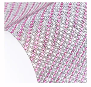 Close-up detail of sparkling pink and silver self-adhesive rhinestone crystal mesh sheet.