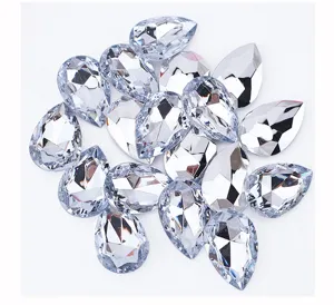 Close-up details of teardrop pointed-back acrylic rhinestones, sparkling faceted crystal gems.