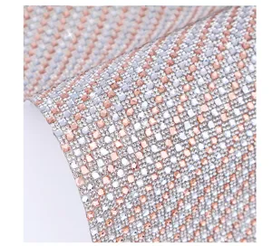 Close-up detail of self-adhesive rhinestone crystal glass diamond sticker mosaic roll sheet.