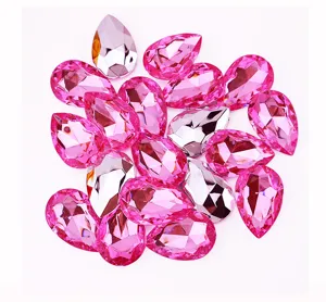 Detailed close-up view of colorful teardrop acrylic rhinestones for crafts and apparel.