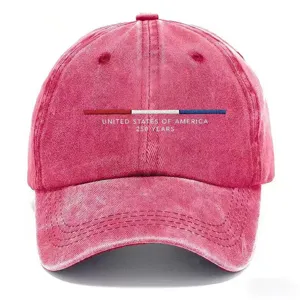 Close-up detail of the vintage washed baseball cap front print and fabric texture.