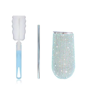 Detailed view of the 6oz rhinestone tumbler set, including stainless steel straw and sponge brush.