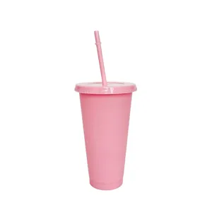 Close-up detail of the pink plastic tumbler featuring a matching lid and convenient straw.