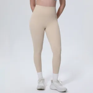 High-waisted nude athletic yoga pants detail, soft skin-friendly fabric, active fitness fit.
