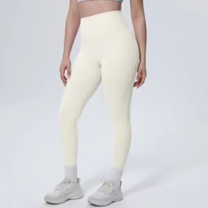 High-waisted solid color yoga leggings detail showing slim fit and perfect shaping effect.