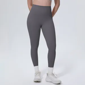 Close-up detail of high-waisted dark grey yoga pants, comfortable fit for fitness workouts.
