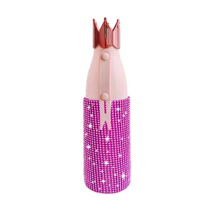 Close-up of pink rhinestone thermos cup detail showing sparkling crystal diamonds and crown lid.