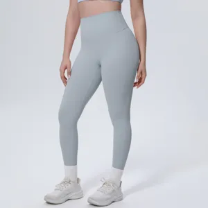 Detail view of high-waist yoga pants in light grey, smooth ice-silk fabric for fitness.