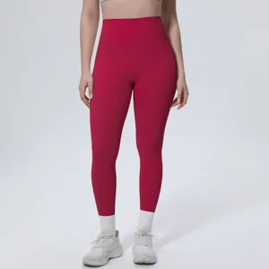 Close-up detail of high-waisted red yoga leggings, soft breathable fitness activewear.