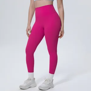 High-waisted pink yoga pants detail view, breathable and stretchy fabric for fitness running.