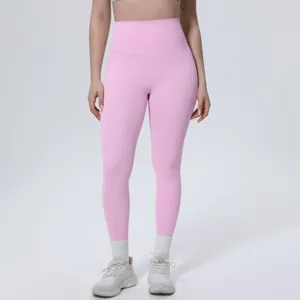 Pink high-waisted seamless yoga pants detailed view, breathable fitness activewear leggings.