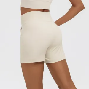 High waist athletic yoga shorts back detail, beige gym fitness workout activewear.