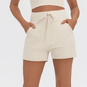 Detail view of high waist drawstring sports shorts, comfortable dual pocket casual fitness wear.