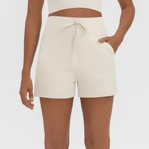 Close-up detail of high waist athletic shorts featuring adjustable drawstring and deep side pockets.