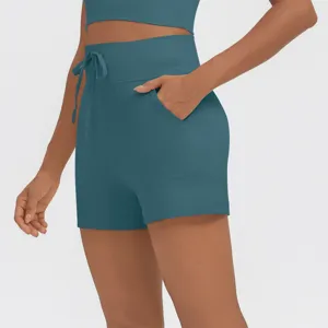 High waist drawstring athletic shorts with side pockets for fitness yoga gym wear detail.