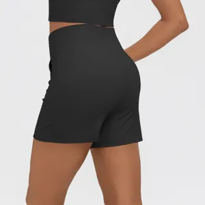 Detailed view of women's high-waisted black athletic yoga shorts featuring convenient side pockets.