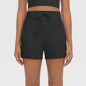 Detail shot of black high-waisted athletic shorts with drawstring and side pockets for women.