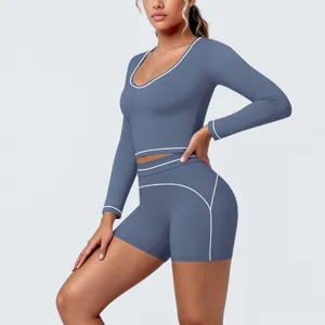 Blue contrasting piping long sleeve crop top and shorts yoga set for fitness gym workouts.