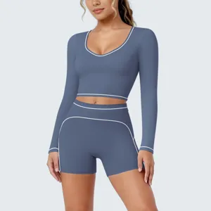 Blue contrast piping long sleeve crop top and shorts yoga set for fitness and running.