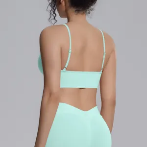 Back view of a mint green seamless yoga set featuring a camisole bra and leggings.