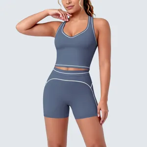 Details view of women contrast piping yoga set, athletic sports bra and workout shorts.