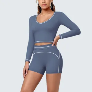 Detail shot of the blue contrast piping long sleeve crop top and shorts yoga fitness set.