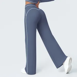 High-waisted activewear flare yoga pants detail showing contrast white piping design back view.