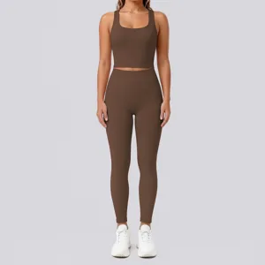Brown ribbed two-piece yoga set detail showing the seamless crop top and high-waisted leggings.