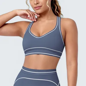 Blauwe sportbh en leggings set met contrastbies, ademende U-rug fitness yoga kleding.