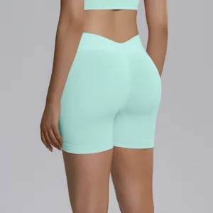 Back detail of mint green seamless high-waist yoga shorts, featuring a V-waist design.