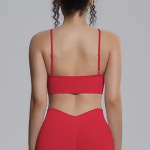 Back view of red seamless stretch yoga bra and leggings set, breathable sportswear detail.