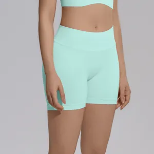 Seamless high-waisted yoga shorts for women, mint green fitness athletic running activewear.