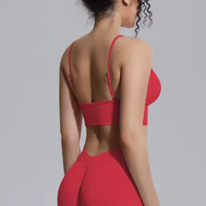 Detail view showing the back straps and seamless high-waist fit of the red yoga activewear.