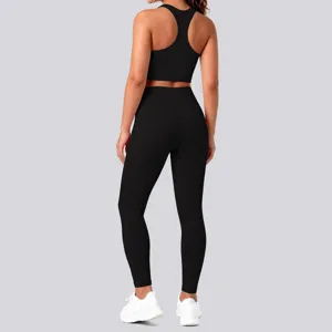 Black seamless backless sports bra and high waist leggings yoga set for fitness training.