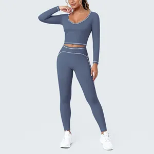 Detailed view of the blue-grey long sleeve crop top and matching high-waisted leggings.